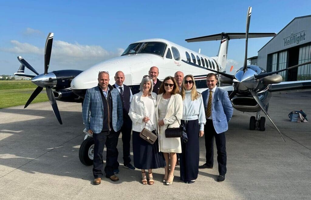 Venatour VIP guests in front of a private jet before their trip to Paris.