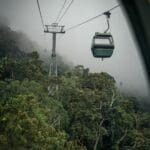 Cable car over misty rainforest